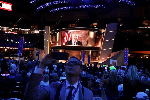 Trump addressed the convention arena remotely last night, using the giant jumbotron. (Getty)